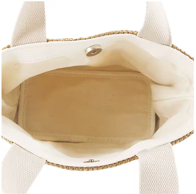 Bolso de rafia y algodón de la marca VESKA, con diseño elegante y detalles naturales, visible en la imagen.