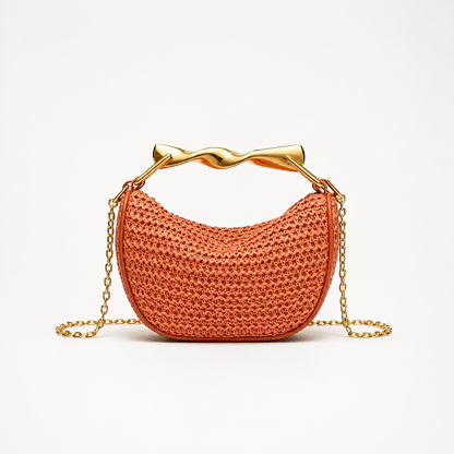 Bolso trenzado Veska con asa metálica, diseño elegante y detalles en cuerda, ideal para ocasiones casuales y elegantes.