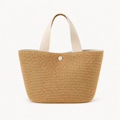 Bolso de rafia y algodón de VESKA, con diseño con asas y detalles textiles, ideal para llevar en verano o ocasiones casuales.