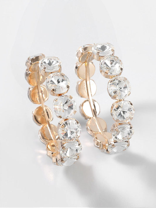 Pendientes aro Veska con piedras engastadas, aretes elegantes de aro con detalles brillantes y acabado metálico.