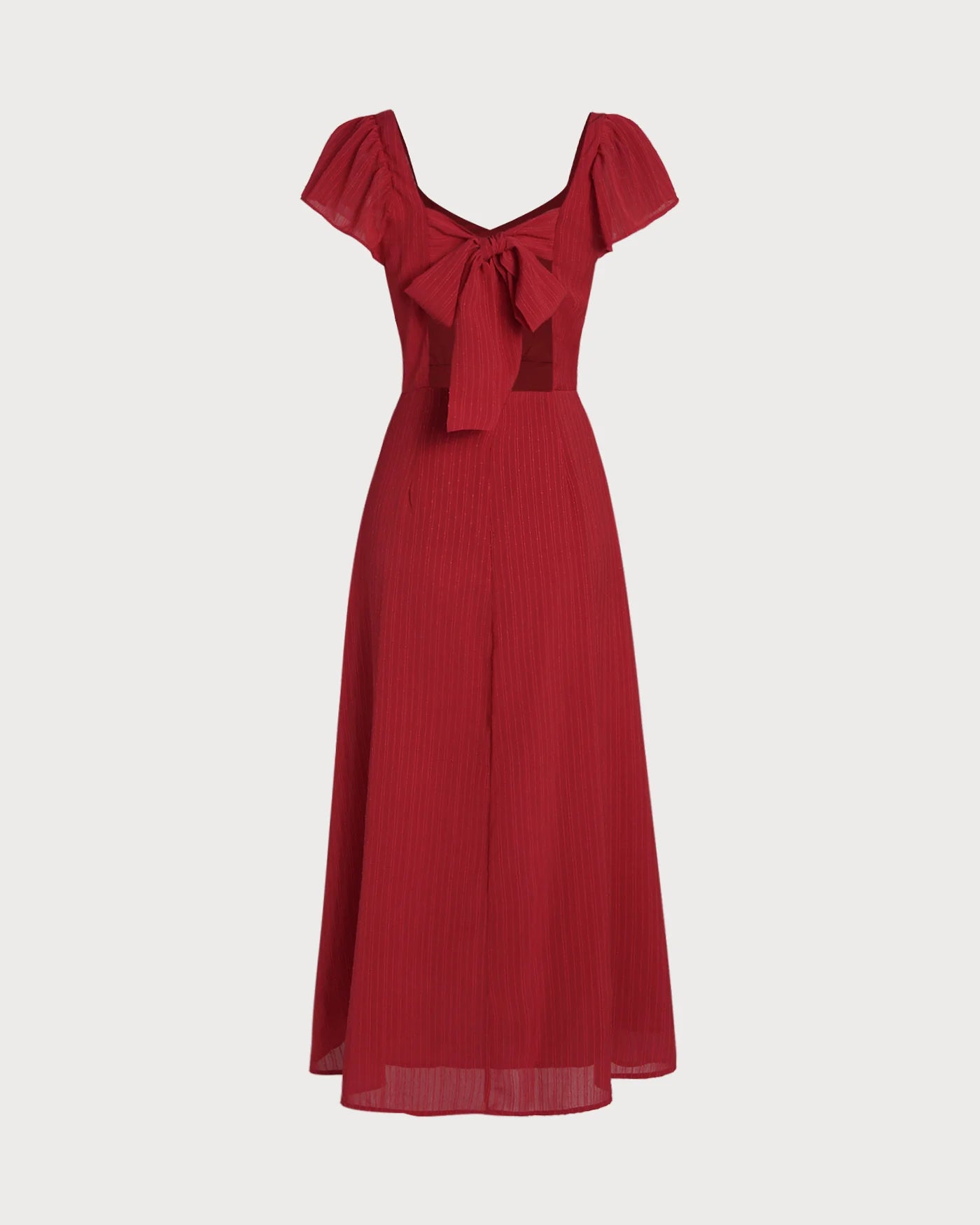 Vestido de gala VESKA con silueta en A, confeccionado en un sofisticado tejido Jacquard de alta estructura.