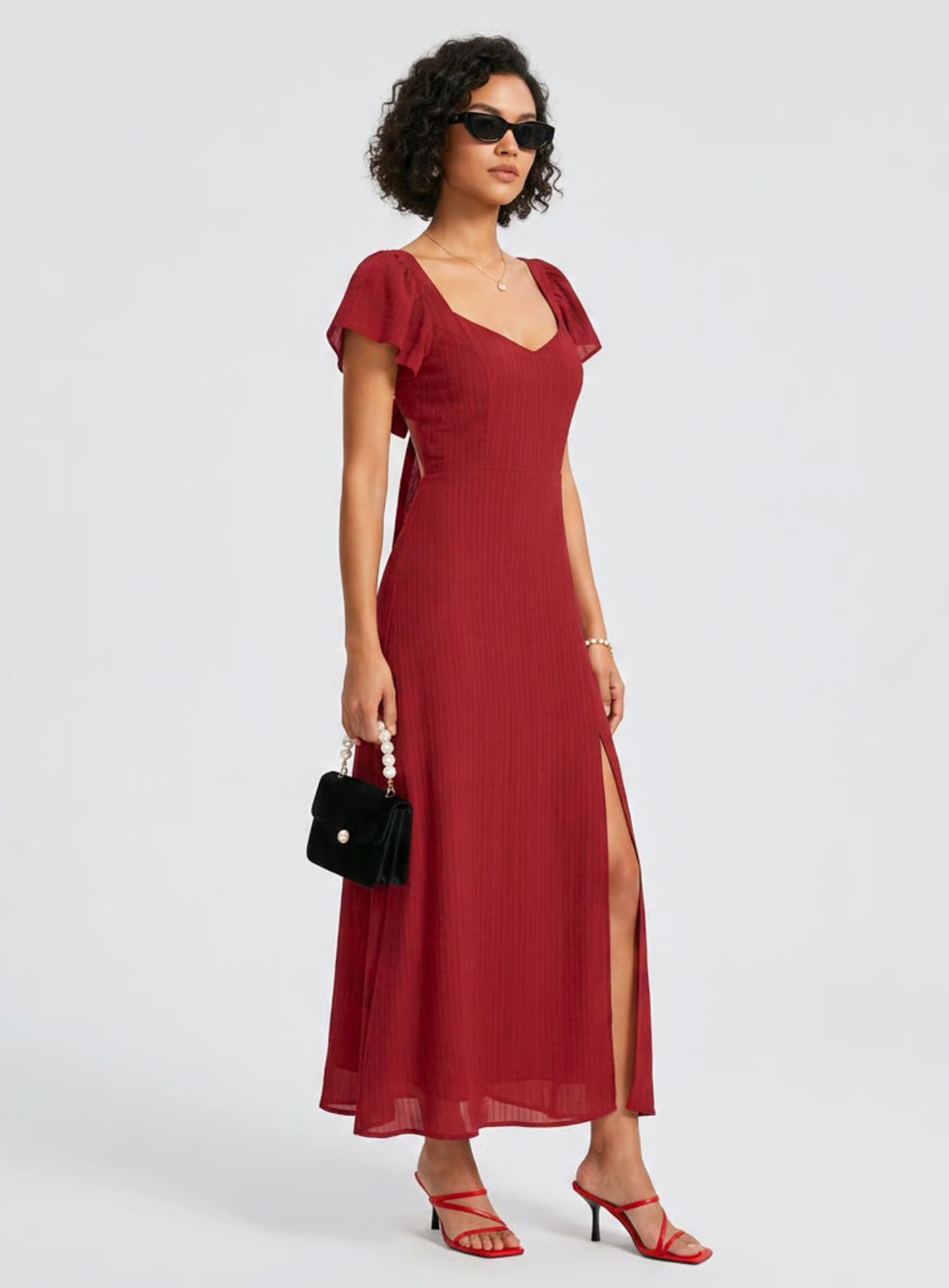 Vestido de gala VESKA con silueta en A, confeccionado en un sofisticado tejido Jacquard de alta estructura.