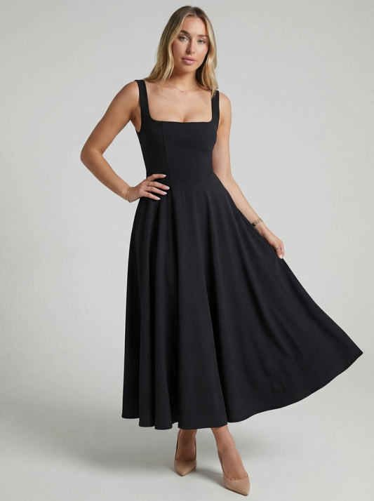 Vestido de vuelo Melissa de Veska en color claro, con falda amplia y detalles elegantes, presentado en una toma en interior.