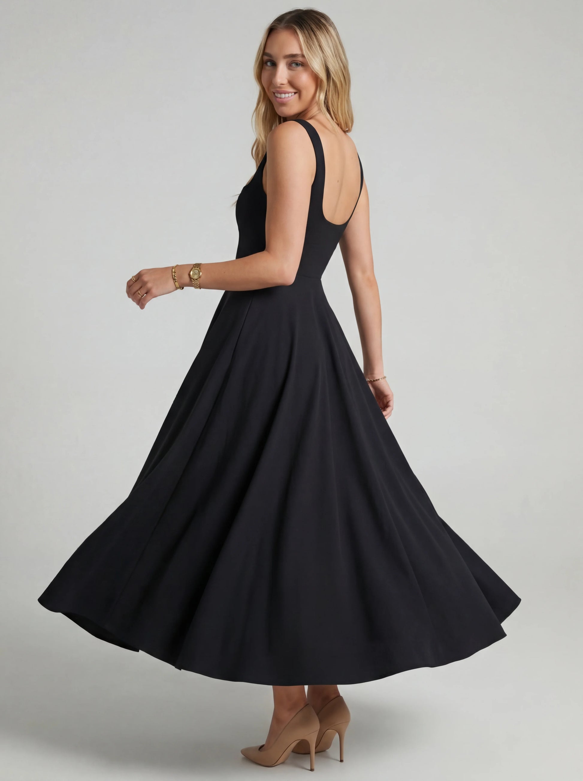 Vestido vuelo de Melissa por Veska, con diseño ligero y elegante, en tonos suaves, mostrando la tela y el corte del vestido.