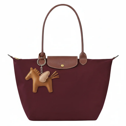 https://cdn.shopify.com/s/files/1/0891/6300/6288/files/imgi_4_Bag_with_Pegasus_Keychain.png?v=1774952207