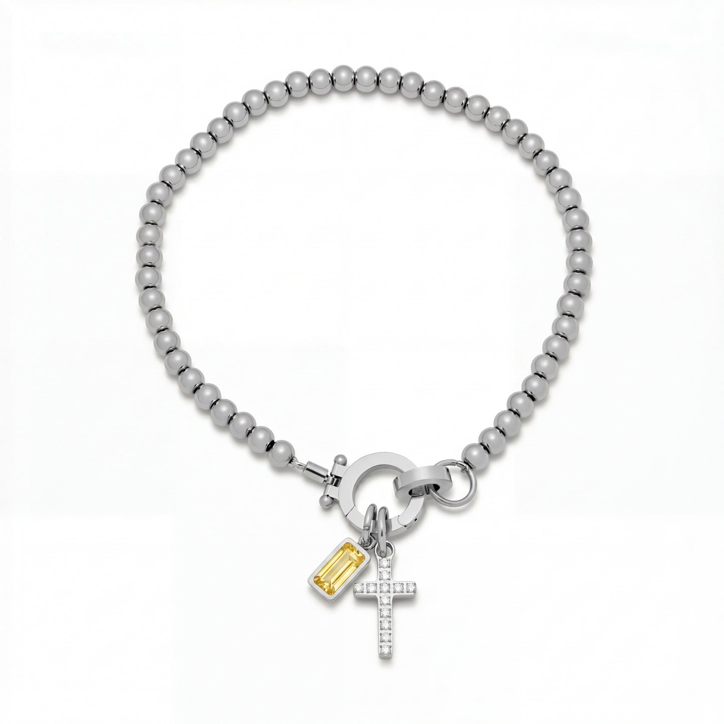 Pulsera Veska con dije de cruz y piedra natal en joyería de plata, con detalles elegantes y estilo sofisticado.