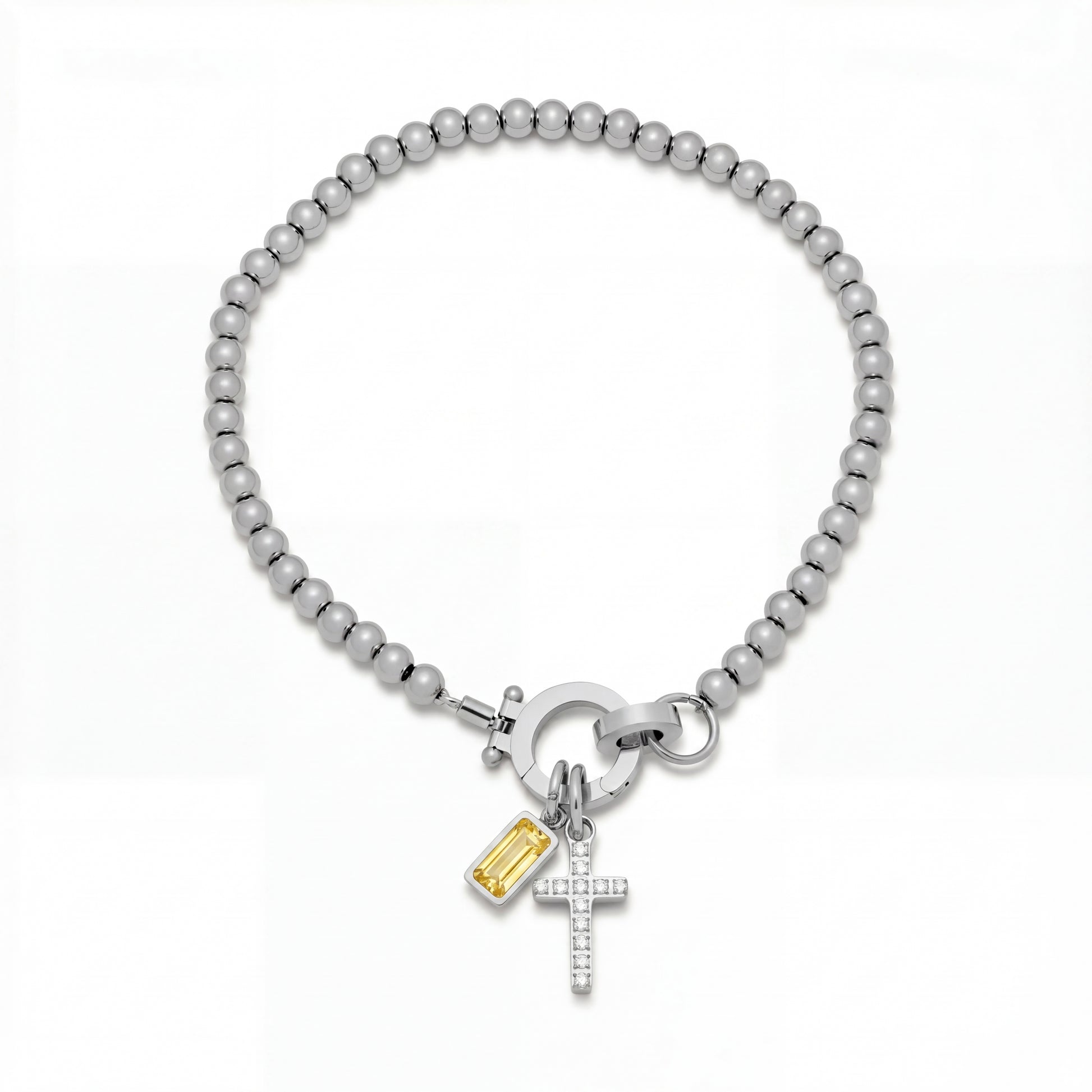 Pulsera Veska con dije de cruz y piedra natal en joyería de plata, con detalles elegantes y estilo sofisticado.