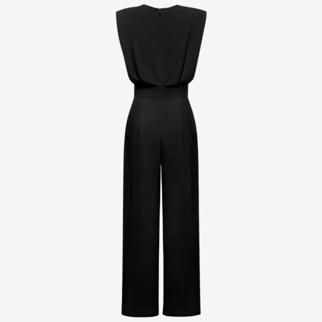 Vestido mono Veska con cinturilla definida y diseño ajustado, en color negro, mostrando su estilo elegante y moderno.